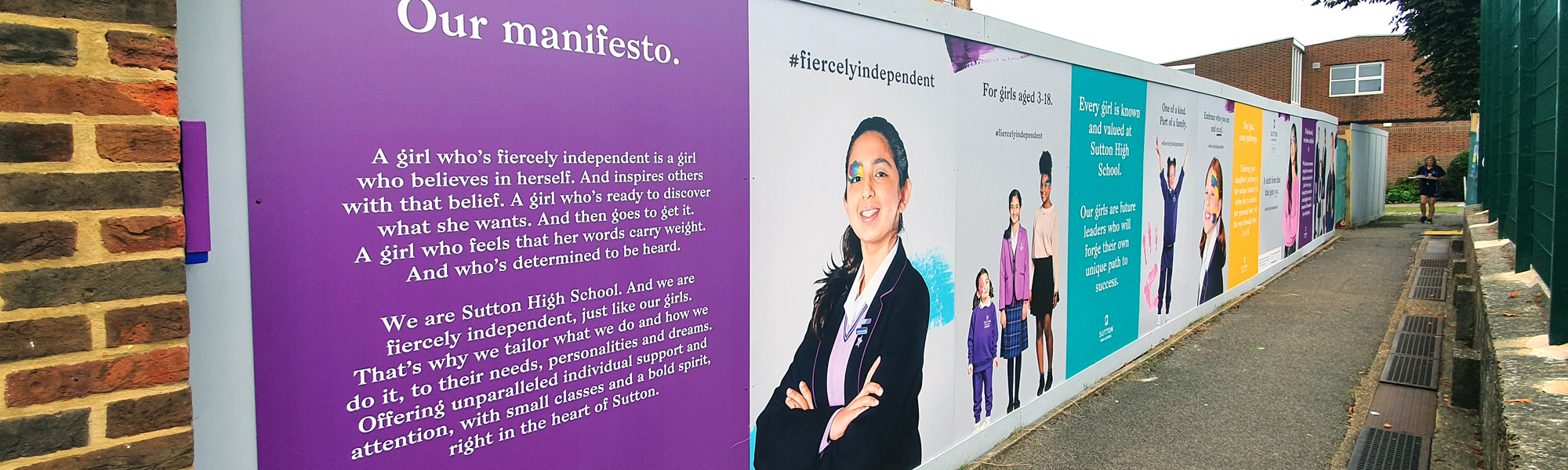 Colourful school hoarding graphics