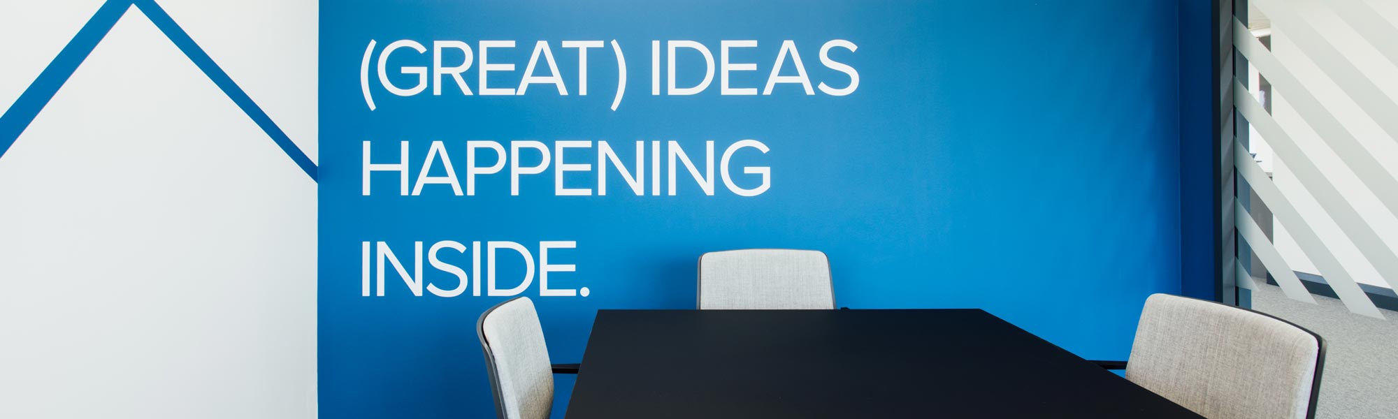 Office Wall Graphics on one-piece wallpaper. Custom printed and installed